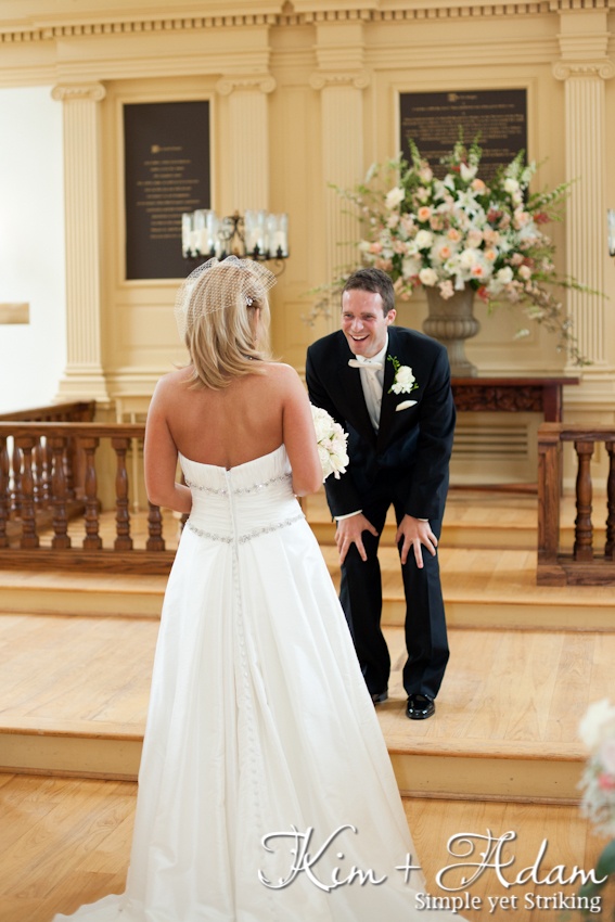 We love this look of Bride surprising the Groom in the church before the ceremony. Photography by Kim + Adam Photography