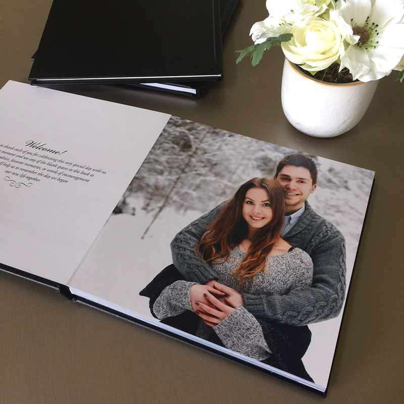 Photo guest book you can personalize with your engagement photos.