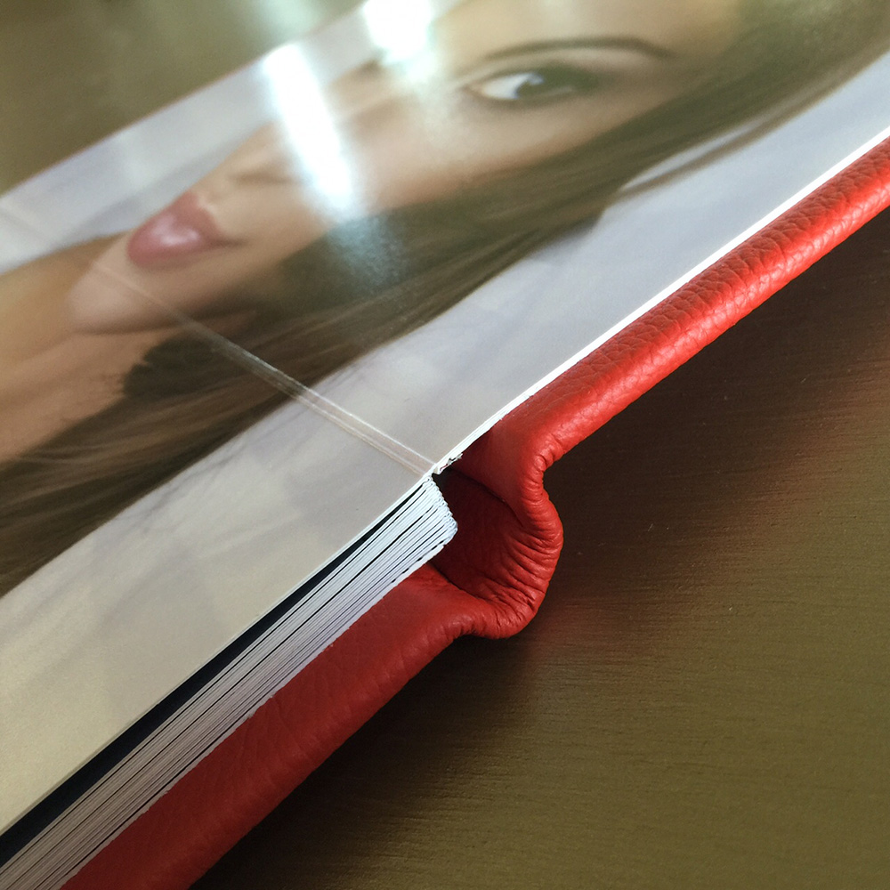 Lay flat boudoir book with red leather cover