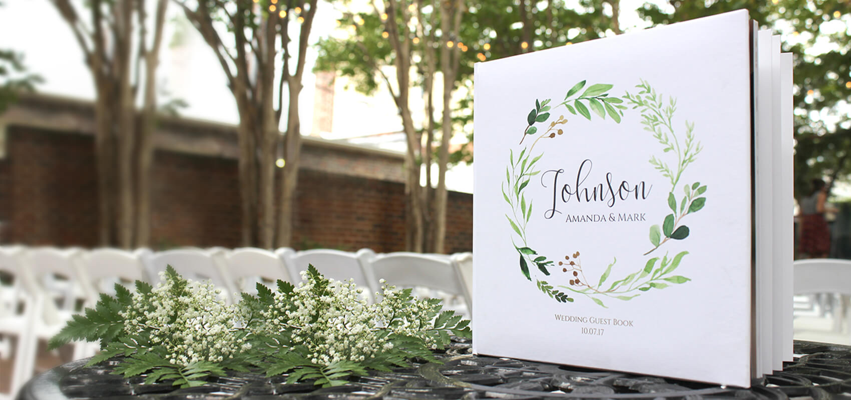 Wedding guest book featuring engagement photos.