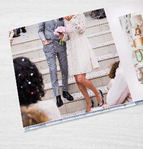 Layflat wedding photo album featuring a confetti scene of a bride and groom on steps.