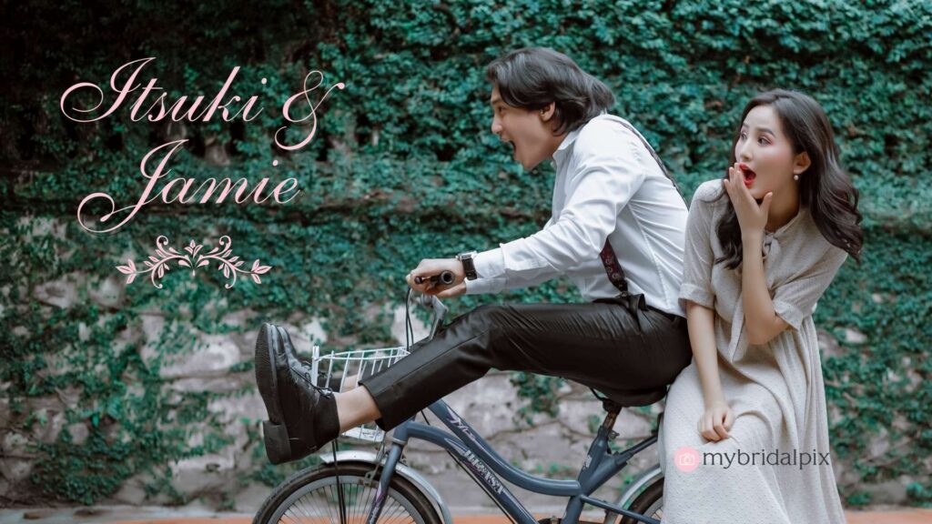 A digital-style wedding guest book for Itsuki & Jamie. The image features the couple on a bicycle, suggesting a theme or style that emphasizes a journey or adventure. It's likely a creative wedding guest book design, tailored to a couple who are or enjoy being digital nomads.