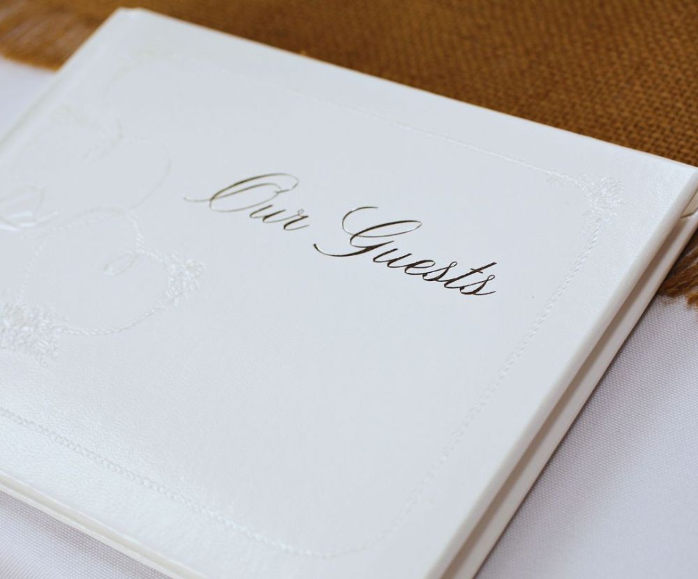 a closeup image of a Weeding Guest book, this image is part of an article about how to make your own Weeding guest book, ideas, templates, and a simple Guide.