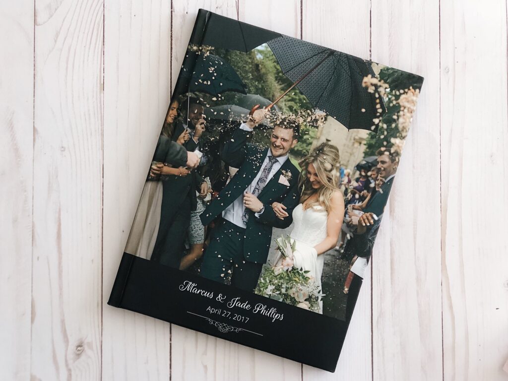 A happy couple on their wedding with guests showering them with love. 