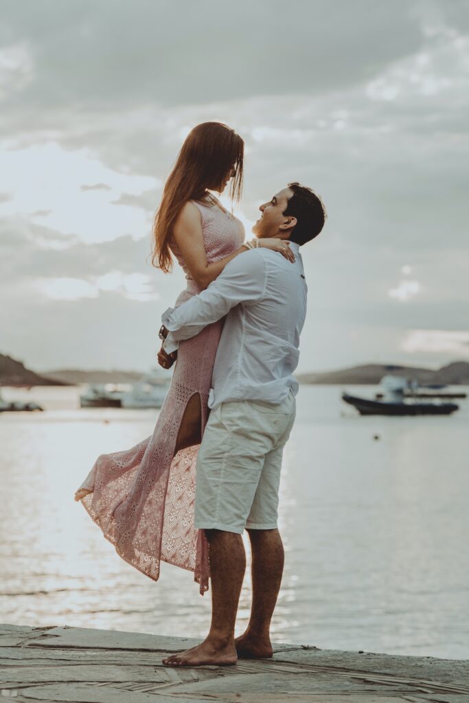 A happy couple outdoors, capturing a joyful moment.